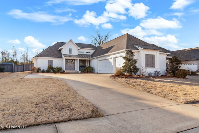 view of front of home featuring a garage and a front yard