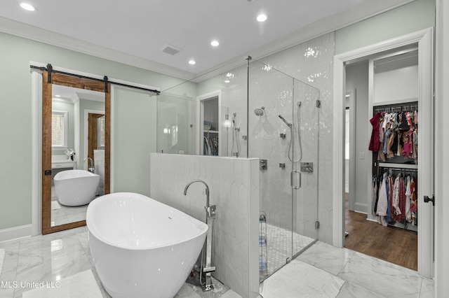 bathroom with visible vents, ornamental molding, a shower stall, a spacious closet, and marble finish floor