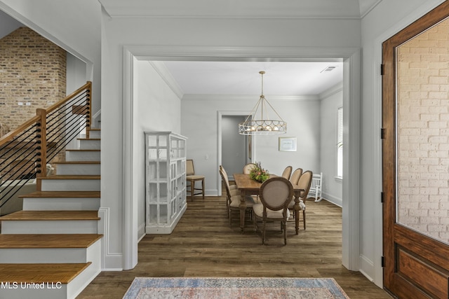 dining space with an inviting chandelier, stairway, crown molding, and dark wood-style flooring