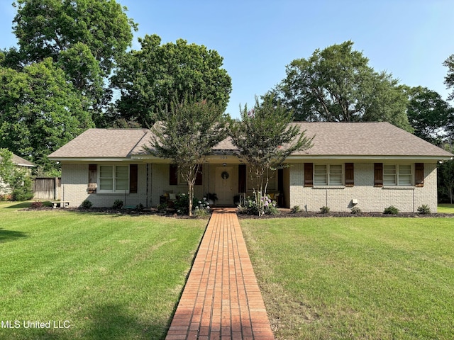 503 E Adams Ave, Greenwood, MS 38930 - ranch-style home featuring brick siding, a front yard, and a shingled roof