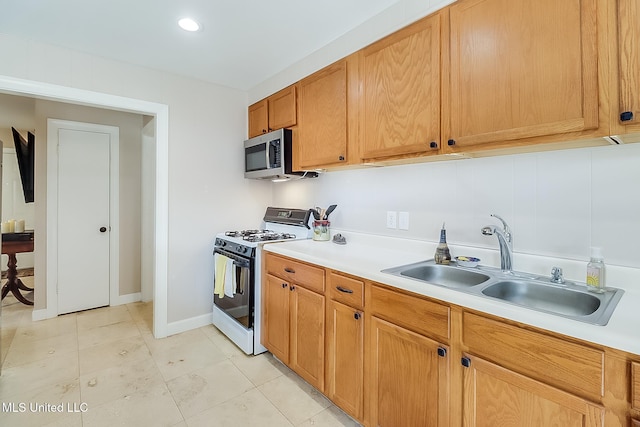 kitchen with sink and range with gas cooktop