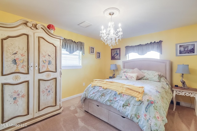 carpeted bedroom featuring a chandelier