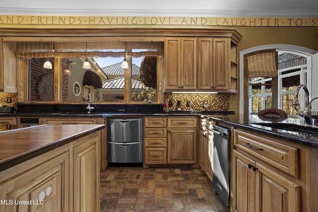 kitchen featuring a wealth of natural light, brick floor, and backsplash