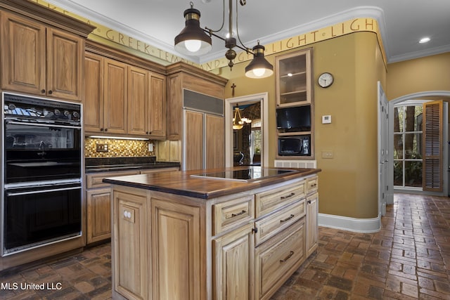 kitchen with baseboards, brick floor, ornamental molding, decorative backsplash, and black appliances