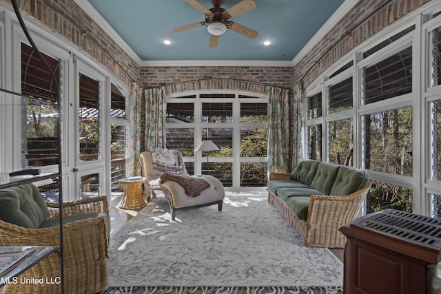 sunroom with ceiling fan
