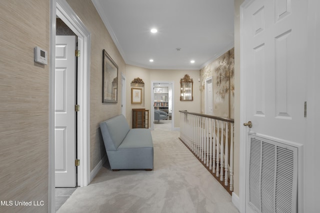 corridor featuring visible vents, recessed lighting, carpet, crown molding, and baseboards