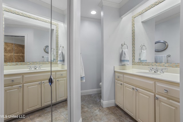 bathroom featuring crown molding and a sink