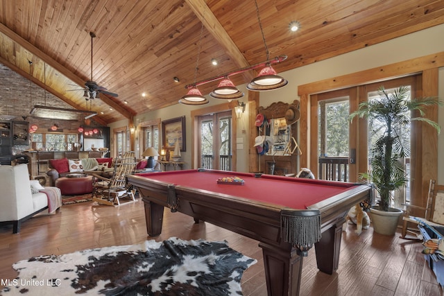 game room featuring beam ceiling, french doors, and wood-type flooring