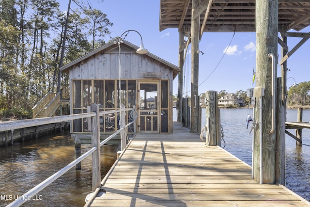 view of dock featuring a water view and boat lift