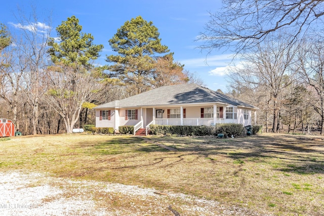 view of front of property with covered porch and a front lawn