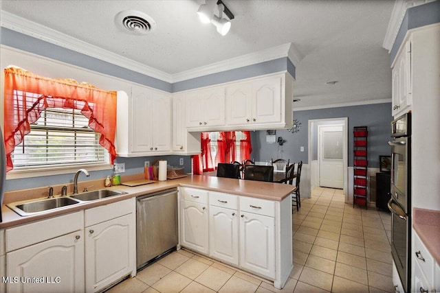 5967 Huntview Dr, Jackson, MS 39206 - kitchen featuring dishwasher, a sink, light tile patterned floors, a peninsula, and crown molding