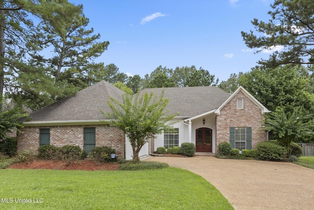 144 Whisper Lake Blvd, Madison, MS 39110 - view of front of house featuring french doors, concrete driveway, a shingled roof, and brick siding
