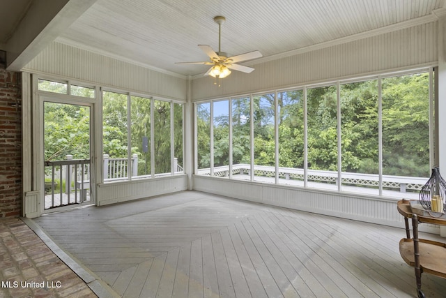 144 Whisper Lake Blvd, Madison, MS 39110 - unfurnished sunroom with a ceiling fan and view of wooded area