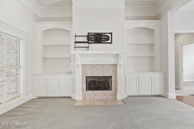 144 Whisper Lake Blvd, Madison, MS 39110 - unfurnished living room with built in shelves, carpet, crown molding, and a fireplace