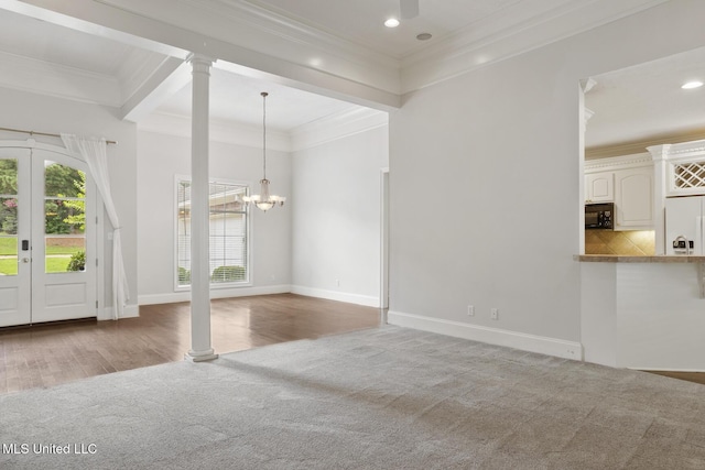 144 Whisper Lake Blvd, Madison, MS 39110 - unfurnished living room featuring carpet floors, crown molding, decorative columns, a chandelier, and recessed lighting