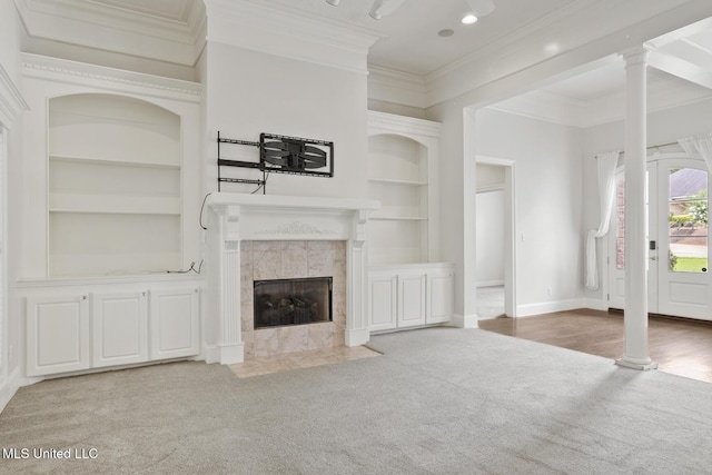 144 Whisper Lake Blvd, Madison, MS 39110 - unfurnished living room with carpet, built in features, a fireplace, ornamental molding, and recessed lighting