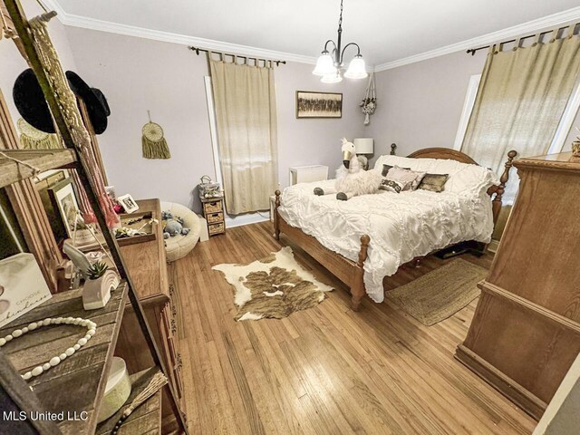 1802 Robinson St, Natchez, MS 39120 - bedroom with crown molding, wood finished floors, and a fireplace with raised hearth