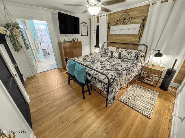 1802 Robinson St, Natchez, MS 39120 - bedroom with light wood-style flooring, a ceiling fan, and crown molding
