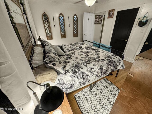 1802 Robinson St, Natchez, MS 39120 - bedroom with crown molding and wood finished floors