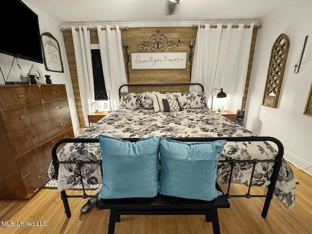 1802 Robinson St, Natchez, MS 39120 - bedroom with light wood-style flooring, crown molding, and baseboards