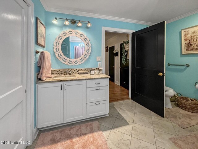 1802 Robinson St, Natchez, MS 39120 - full bath with toilet, vanity, and ornamental molding