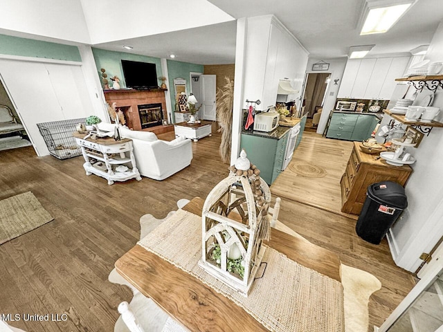 1802 Robinson St, Natchez, MS 39120 - living area featuring a tiled fireplace and light wood finished floors