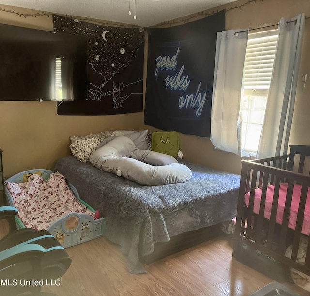 900 Orange St, Ocean Springs, MS 39564 - bedroom with wood finished floors