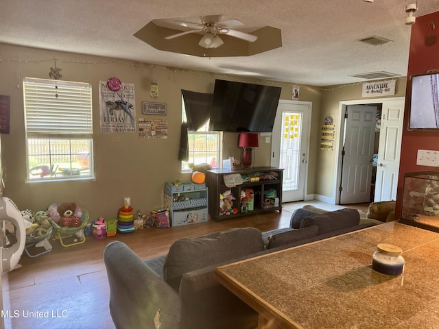 900 Orange St, Ocean Springs, MS 39564 - living room with a textured ceiling and a ceiling fan