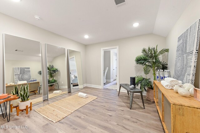sitting room with light wood-style floors, recessed lighting, and baseboards