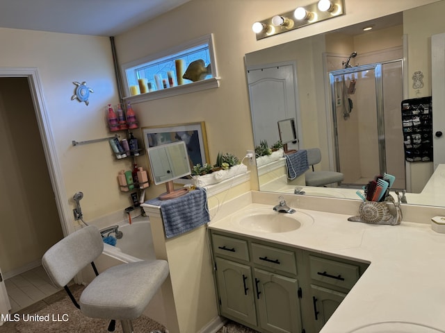 bathroom featuring tile patterned flooring, vanity, and an enclosed shower