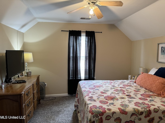 bedroom with ceiling fan, dark carpet, and vaulted ceiling