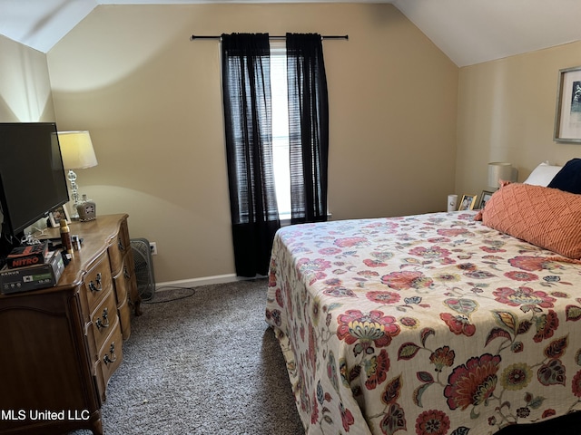 carpeted bedroom with lofted ceiling