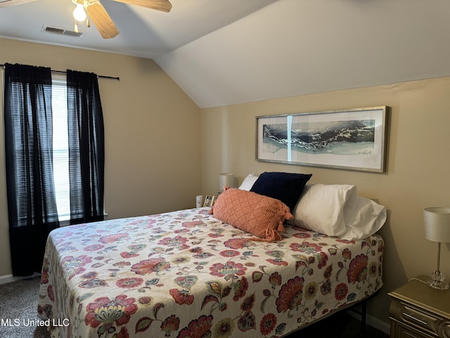 carpeted bedroom featuring ceiling fan and lofted ceiling