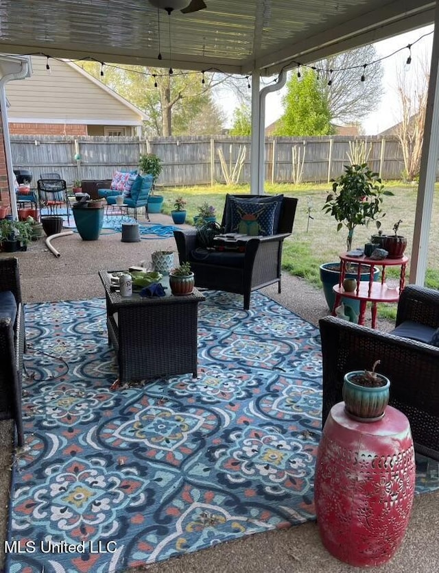 view of patio featuring ceiling fan and an outdoor hangout area