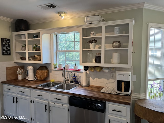 kitchen with wood counters, backsplash, sink, dishwasher, and white cabinetry