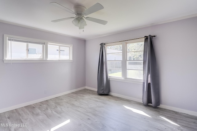 spare room with ceiling fan, light hardwood / wood-style floors, and ornamental molding