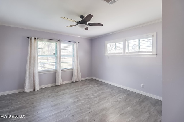 empty room featuring light hardwood / wood-style flooring, ceiling fan, and crown molding