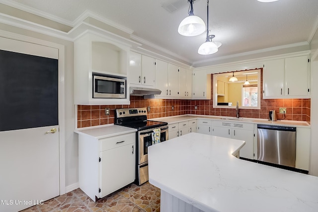 kitchen with sink, crown molding, decorative light fixtures, white cabinets, and appliances with stainless steel finishes