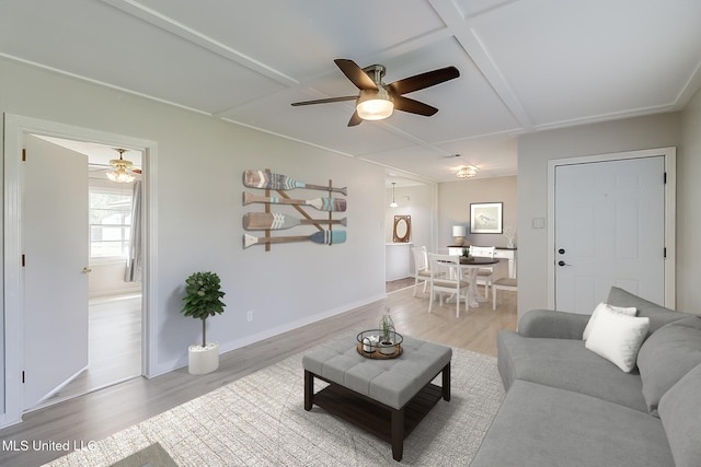 5211 Washington Ave, Gulfport, MS 39507 - living area with ceiling fan, light wood-style floors, and baseboards