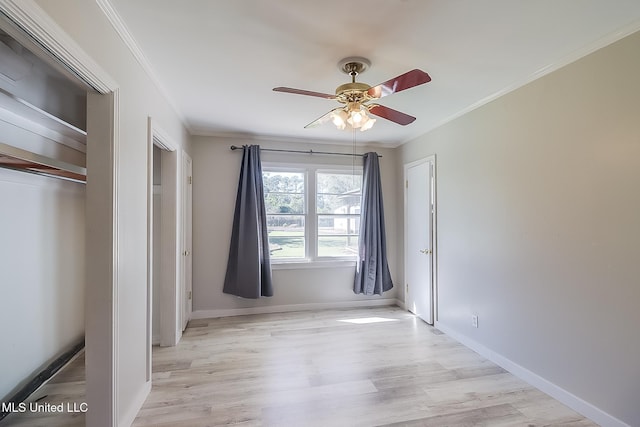 unfurnished bedroom featuring ceiling fan, light hardwood / wood-style floors, and ornamental molding