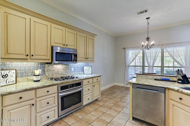 kitchen featuring a notable chandelier, stainless steel appliances, light tile patterned floors, and crown molding