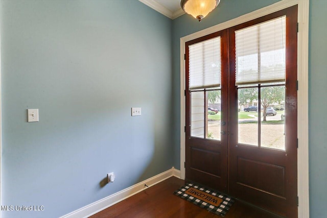 doorway with ornamental molding, french doors, and hardwood / wood-style floors