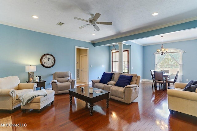 living room with ceiling fan with notable chandelier, a textured ceiling, decorative columns, dark hardwood / wood-style flooring, and ornamental molding