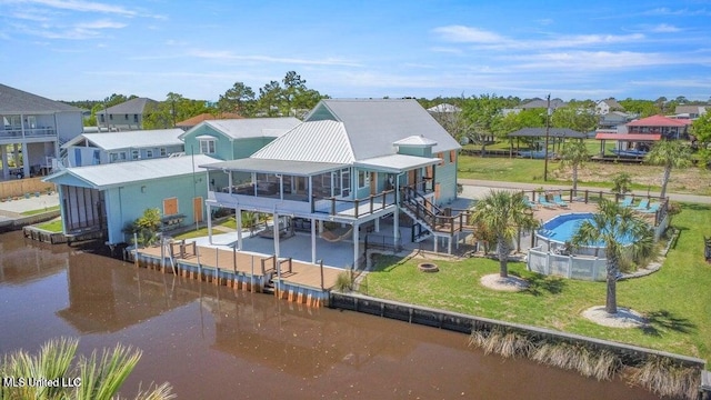 842 Deer Dr, Bay Saint Louis, MS 39520 - rear view of property with a residential view, a patio area, metal roof, and a water view
