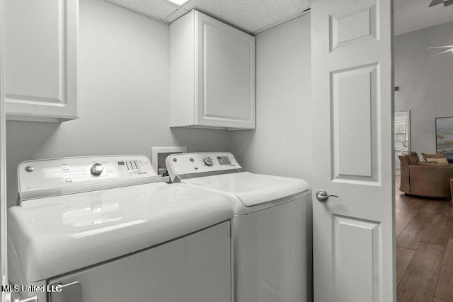 842 Deer Dr, Bay Saint Louis, MS 39520 - washroom with cabinet space, separate washer and dryer, and wood finished floors