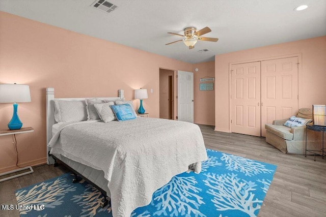 842 Deer Dr, Bay Saint Louis, MS 39520 - bedroom featuring wood finished floors, a closet, a ceiling fan, and baseboards