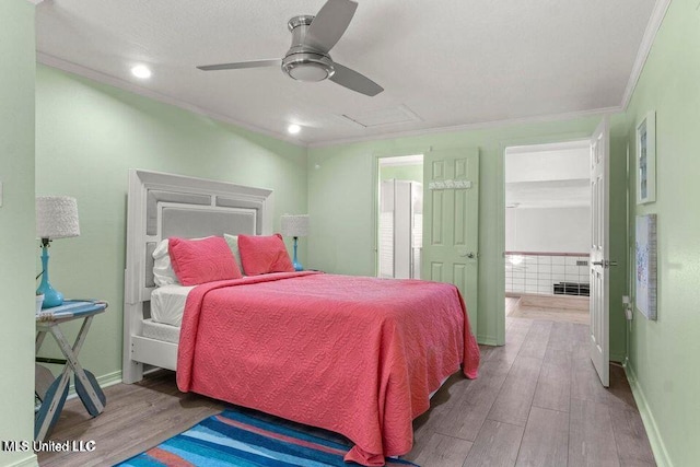 842 Deer Dr, Bay Saint Louis, MS 39520 - bedroom with wood finished floors, ornamental molding, baseboards, attic access, and a ceiling fan