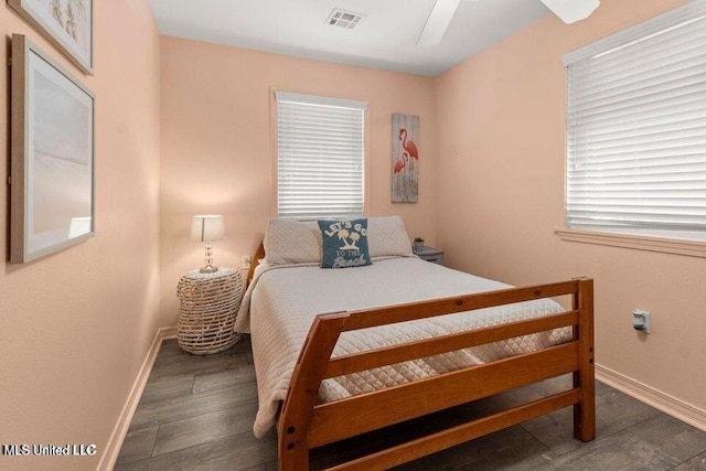 842 Deer Dr, Bay Saint Louis, MS 39520 - bedroom with baseboards, wood finished floors, and a ceiling fan