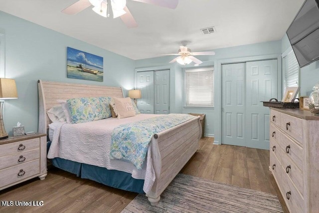 842 Deer Dr, Bay Saint Louis, MS 39520 - bedroom with two closets, wood finished floors, and a ceiling fan