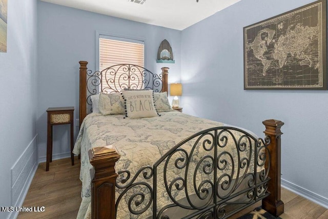 842 Deer Dr, Bay Saint Louis, MS 39520 - bedroom featuring wood finished floors and baseboards